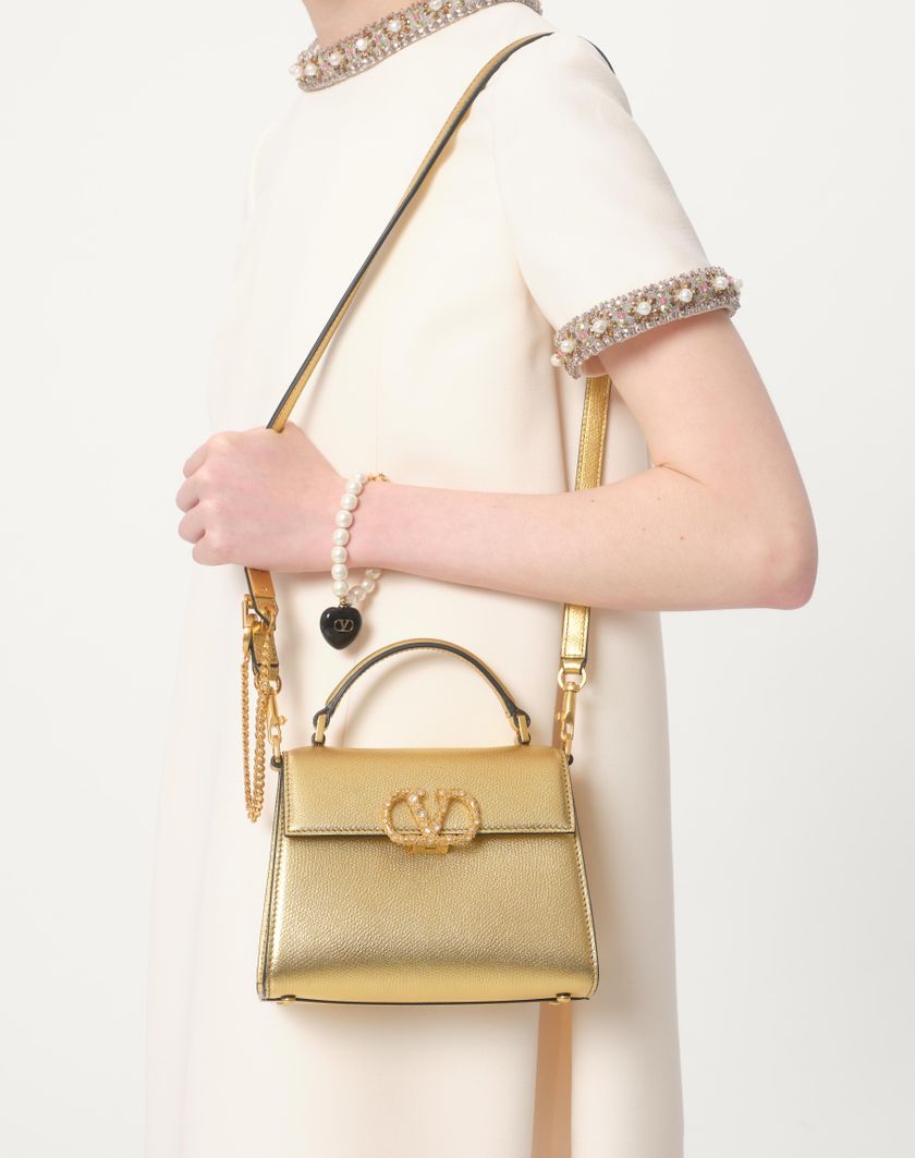 Valentino Handbags Borsa A Mano Mini Valentino Garavani Vsling In Vitello Granato Laminato Con Logo Gioiello per Donna in Antique Brass | Valentino IT Promozione Limitata