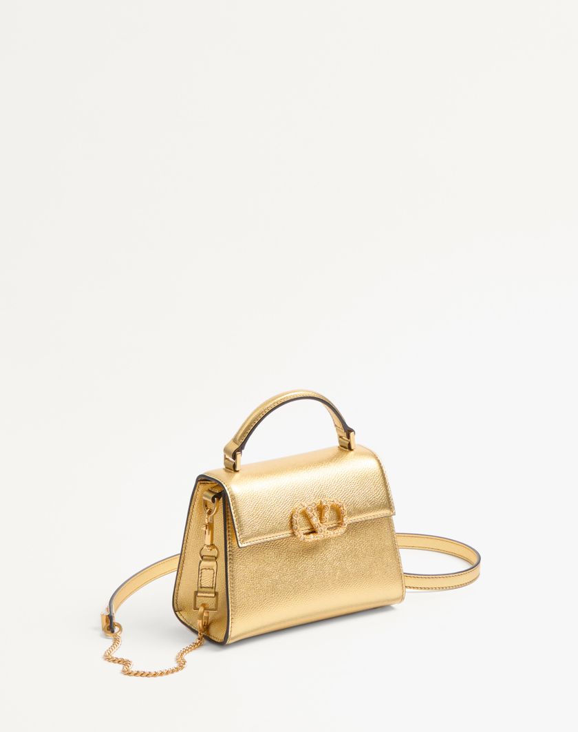 Valentino Handbags Borsa A Mano Mini Valentino Garavani Vsling In Vitello Granato Laminato Con Logo Gioiello per Donna in Antique Brass | Valentino IT Promozione Limitata